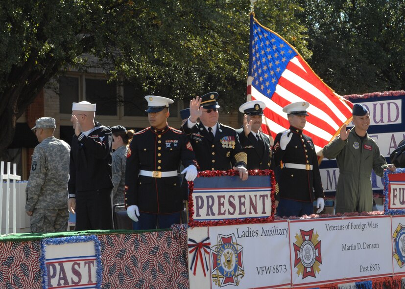 ABILENE, Texas -- Military members wave to onlooking crowds at the Veteran's Day Parade  Nov 15. (U.S. Air Force photo/ Senior Airman Jennifer Romig)