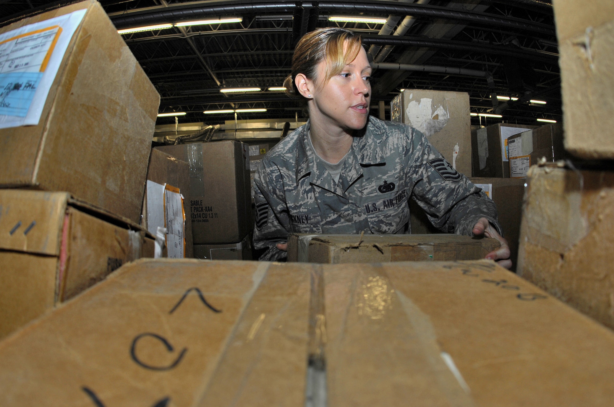 MINOT AIR FORCE BASE, N.D. -- Tech. Sgt. Michelle Hackney, 5th Logistics Readiness Squadron Mobility Readiness Spares Packages assistant noncommissioned officer-in-charge, organizes a crate of supplies during an inventory validation here recently. MRSP Airmen conduct these inventories every week to ensure parts and supplies are ready to support 5th Bomb Wing aircraft both at home station and while deployed. (U.S. Air Force photo by Airman 1st Class Benjamin Stratton)