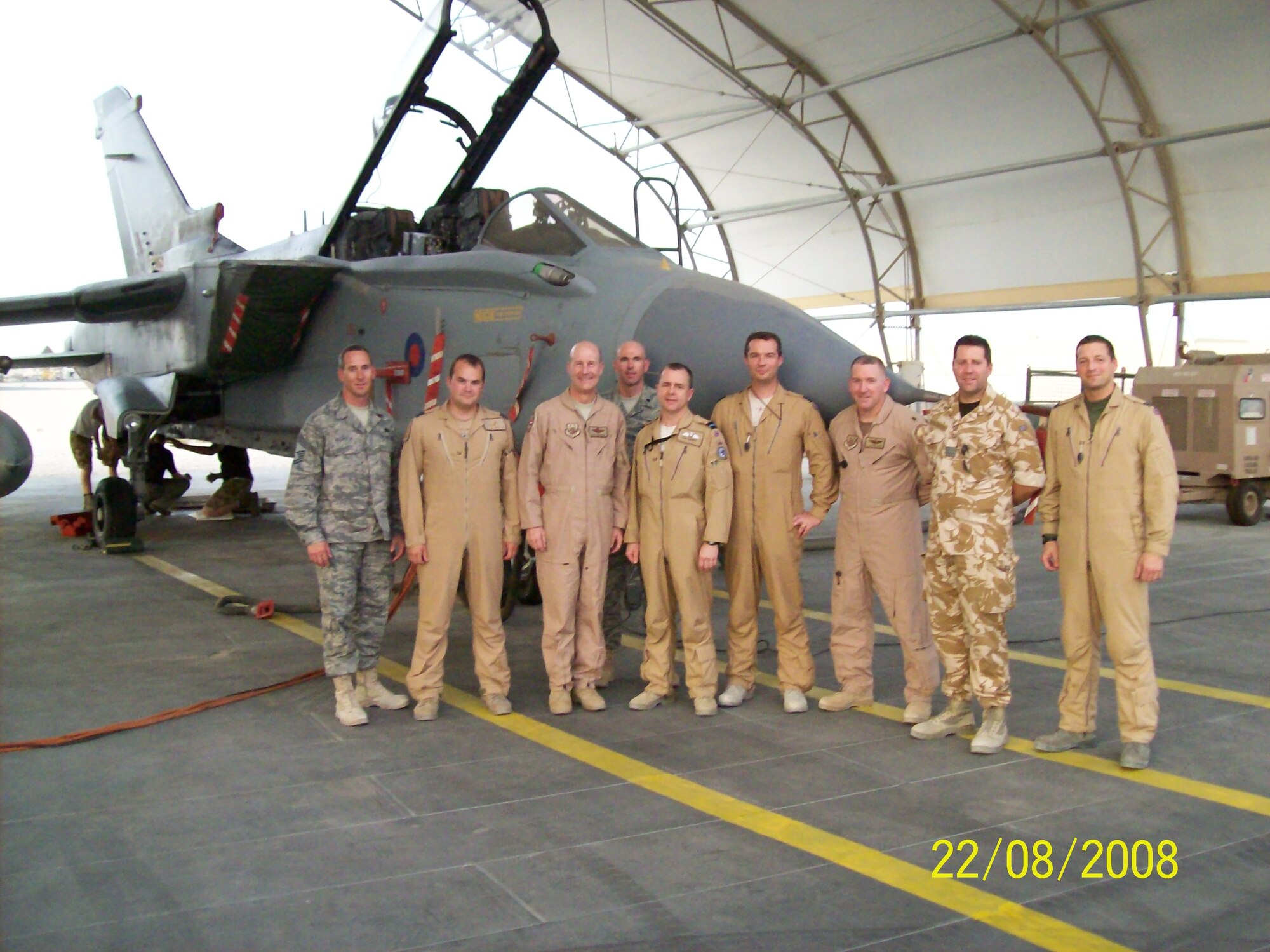 SOUTHWEST ASIA - Maj. Tony Kleiger, third from the right, is currently deployed from Langley.  He said the first thing he will do when he gets home is hug his wife until his arms hurt and then hug her again.  (Courtesy photo)
