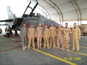 SOUTHWEST ASIA - Maj. Tony Kleiger, third from the right, is currently deployed from Langley.  He said the first thing he will do when he gets home is hug his wife until his arms hurt and then hug her again.  (Courtesy photo)