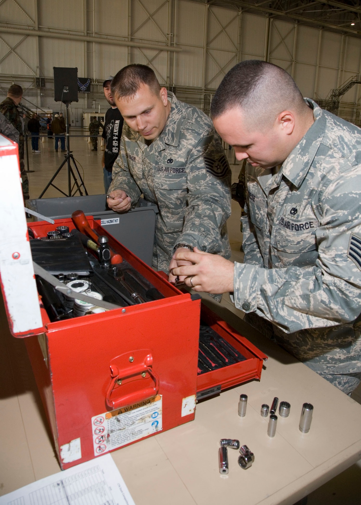 Edwards maintainers sort through a box of loose tools as part of the composite tool kit dash, a competitive event for the 412th Maintenance Group's first Maintenance Olympics at hangar 1600 Nov. 7. After three hours of competition, the 412 Aircraft Maintenance Squadron came out as the victor and took home the highly-coveted first place 412th MXG Maintenance Olympics Wrench. The 412th Logistics Test Squadron took second while the 412th MXG staff took third. (Air Force photo by Chad Bellay)