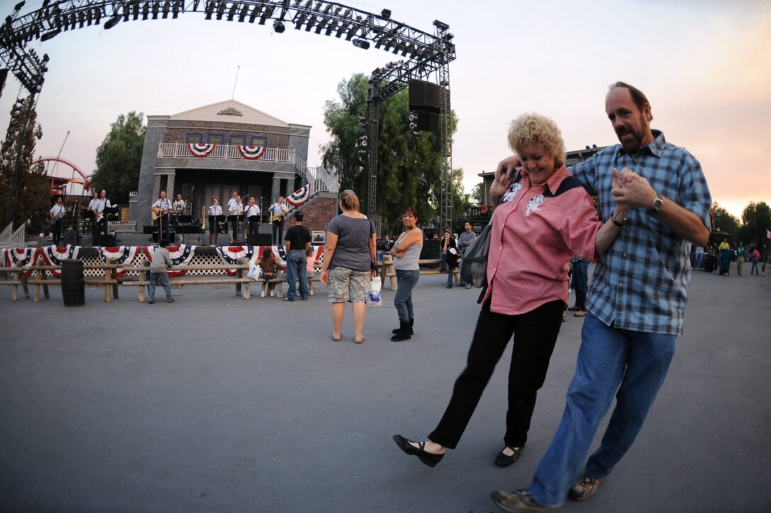 Cheri Greer and John Foote two-step as members of the Air National Guard Band of The Southwest perform at Knott's Berry Farm Nov. 15 in Los Angeles. The band is performing during Air Force Week Los Angeles, which is an event designed to educate the local population about the Air Force's capabilities and missions through various activities and exhibitions all over the Los Angeles area. (U.S. Air Force photo/Staff Sgt. Desiree N. Palacios) 
