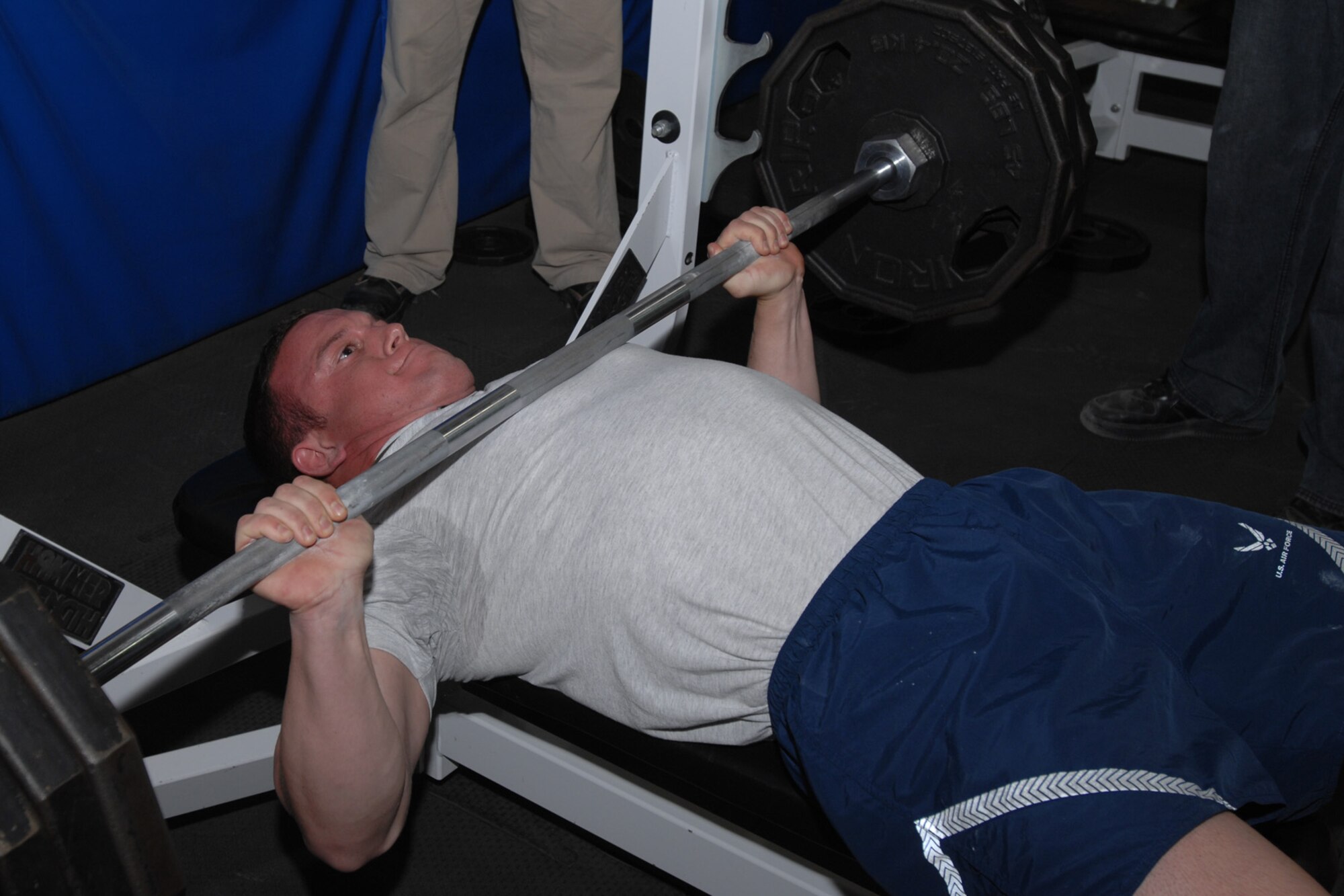 Senior Airman Joshua Moffie prepares to push up his final lift during the Strongman/Woman Competition in the Mt. Warrior Gym Nov. 15, at Kirkuk Regional Air Base, Iraq. Airman Moffie, who is a fire team member for the 506th Expeditionary Security Forces Squadron went on to take first place in the Male category with combined bench and squat lifts of 795 pounds. (U.S. Air Force photo/Tech. Sgt. Jeff Walston)