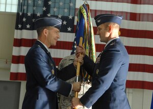 LANGLEY AIR FORCE BASE, Va. -- Col. Dirk Smith accepts command of the 1st Operations Group from Brig. Gen. Mark Barrett, 1st Fighter Wing commander, during a change of command Nov 10. (U.S. Air Force photo/Senior Airman Cecil McCloud) 