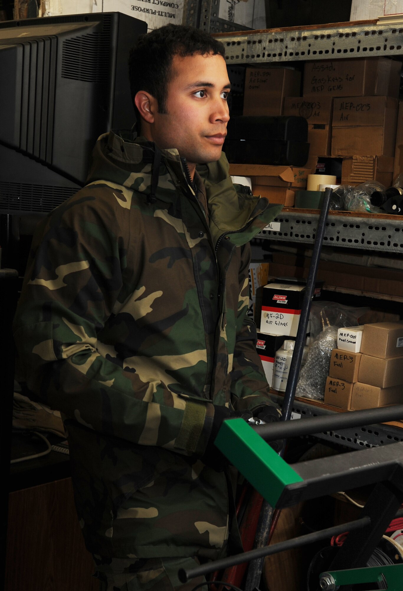 Senior Airman Jason Garcia looks for new battery terminals inside a storage area of the 931st Civil Engineer Squadron during the November Unit Training Assembly. Airman Garcia is a traditional Reservist assigned to the Squadron's power production shop. His squadron is part of the 931st Air Refueling Group, an Air Force Reserve unit at McConnell Air Force Base, Kan. (U.S. Air Force photo/Tech. Sgt. Jason Schaap)