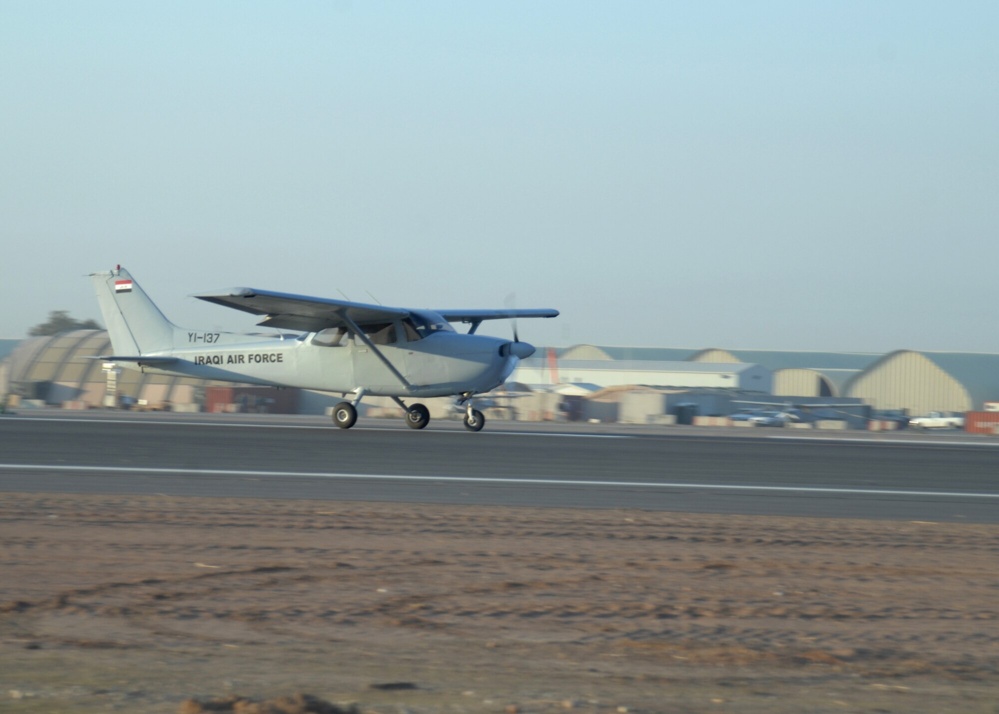 The newly resurfaced runway 14/32 was christened by Iraqi Air Force Lt. Ali Karim, Iraqi Flying Wing pilot trainee, and Capt. Craig Morash, 52nd Expeditionary Flying Training Squadron instructor pilot, in a Cessna 172S Skyhawk at Kirkuk Regional Air Base, Iraq, Nov. 17.  After more than three months the 8,535-foot runway was milled and then resurfaced with more than 38,000 tons of new asphalt. (U.S. Air Force photo/Master Sgt. Andrew Leonhard)