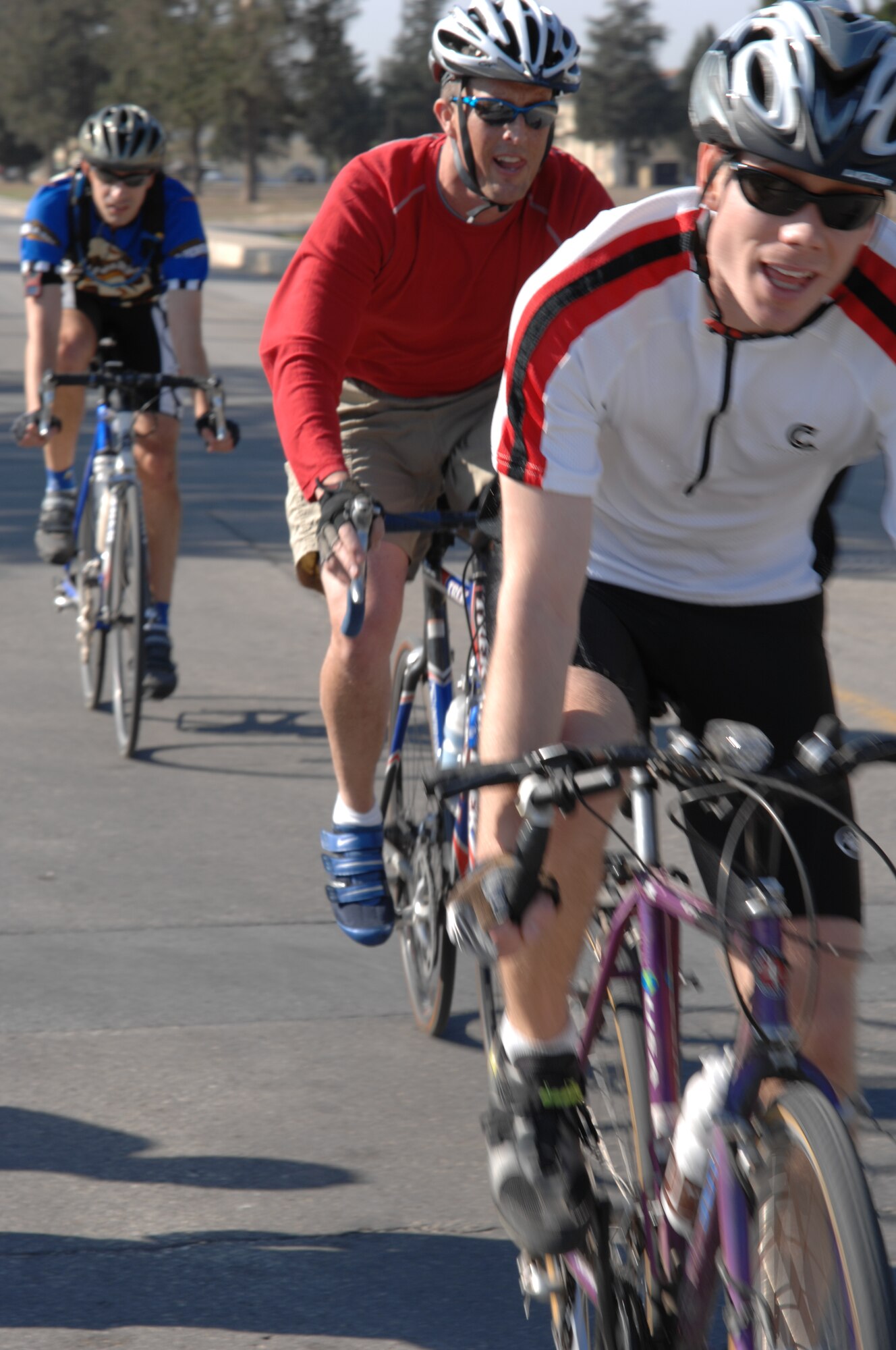 Capt. David Gregory, 39th Medical Operations Squadron, Maj. James Hanson, 39th Medical Support Squadron and Seth Jenny, 39 MDOS, pace themselves during the 39th Air Base Wing Combined Federal Campaign Bike-a-Thon Nov. 15. The trio completed five eight-mile laps around the flightline perimeter, helping raise more than $600.