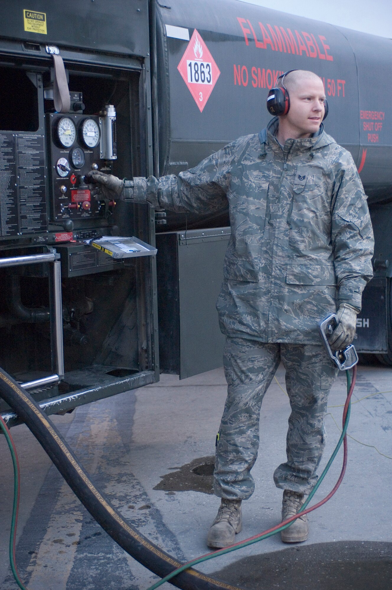 Staff Sgt. Michael Baker, 455th Expeditionary Logistics Readiness Squadron fuels specialist, pumps fuel to a waiting aircraft at Bagram Air Field, Afghanistan, Nov. 14, 2008. Sergeant Baker, a native of Vancouver, Wash., pumped a million gallons of fuel in 58 days, breaking the previous Bagram record by three days. (U.S. Air Force photo by Staff Sgt. Rachel Martinez/Released)