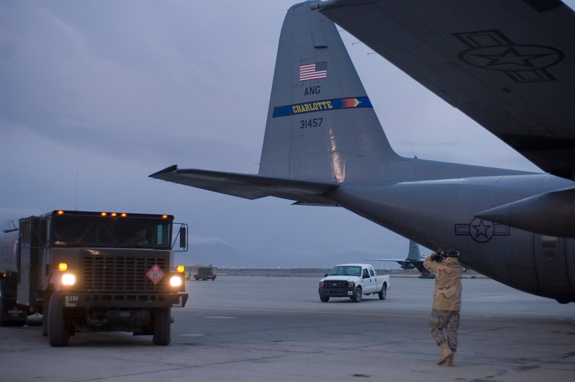 A fuel truck driven by Staff Sgt. Michael Baker pulls up to a C-130 Hercules waiting to be refueled on the Bagram Air Field flightline in Afghanistan Nov. 14, 2008. Sergeant Baker, a fuels specialist for the 455th Expeditionary Logistics Readiness Squadron, surpassed one million gallons of fuel pumped on this particular fuel run. (U.S. Air Force photo by Staff Sgt. Rachel Martinez/Released)