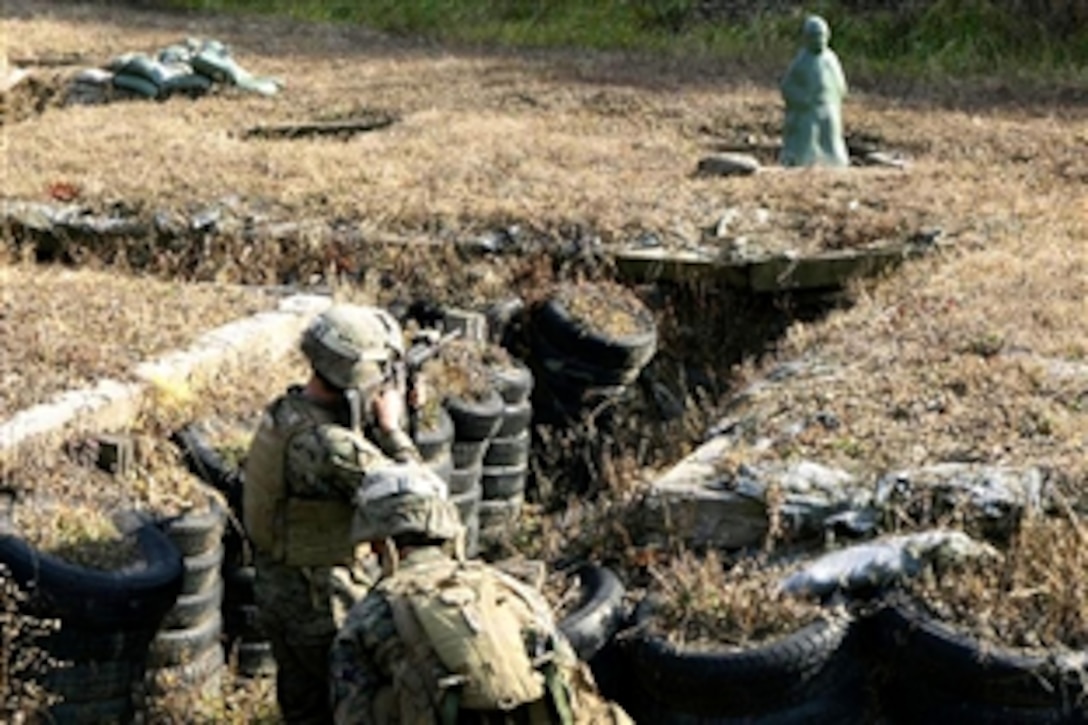 U.S. Marines assigned to a battalion landing team with Whiskey Company, 3rd Battalion, 1st Marine Regiment, 31st Marine Expeditionary Unit engage popup targets during a live-fire trench clearing exercise in Cherokee Valley of the Rodriguez Range in Pocheon, South Korea, Nov. 13, 2008.