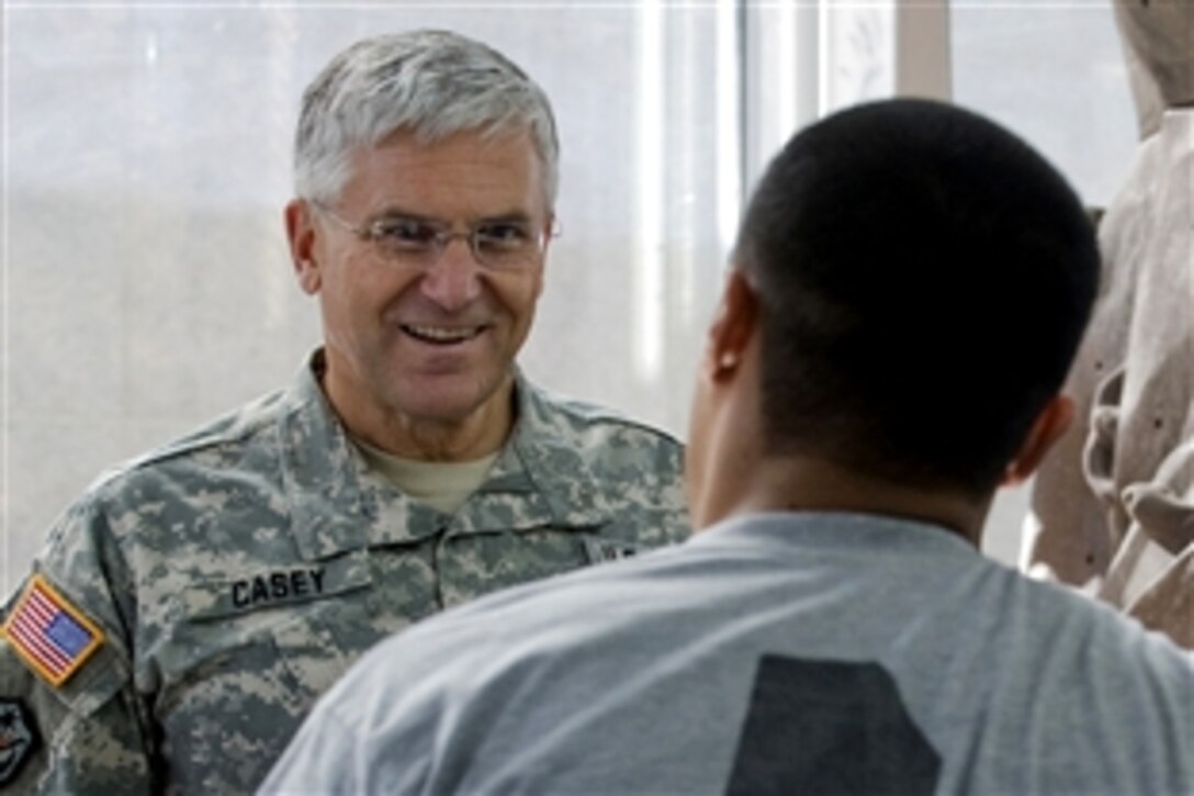 Chief of Staff of the Army Gen. George W, Casey Jr.,  talks with a patient about his experiences at Brooke Army Medical Center, Fort Sam Houston, Texas,  Nov. 17, 2008. 