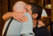 Todd Katz embraces Aaron Mankin as he departs the Katz's home Nov. 17. Todd and Dana Katz hosted the Mankins for dinner during their trip to Los Angeles for Aaron's twelfth surgery at UCLA. Todd, Dana and their children are Operation Mend's premier buddy family, providing friendship and support to Mankin, his wife Diana and their children during Mankin's 12 trips to UCLA. Dana oversees and coordinates the buddy family program. (Official U.S. Marine Corps photo by Staff Sgt. Ethan E. Rocke)