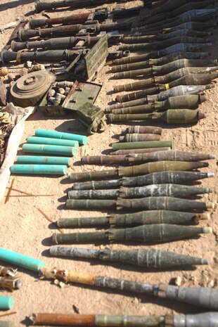 Almost 500 pieces of ordnance were unearthed following the discovery of a weapons cache near the town of Ubaydi, Iraq, Nov. 14.  The cache, which contained rocket propelled grenades, machine guns, bomb-making materials and an anti-tank mine, was unearthed by a Navy explosive ordnance disposal team while security was held by Iraqi Police officers and Marines from Task Force 3rd Battalion, 7th Marine Regiment, Regimental Combat Team 5.::r::::n::