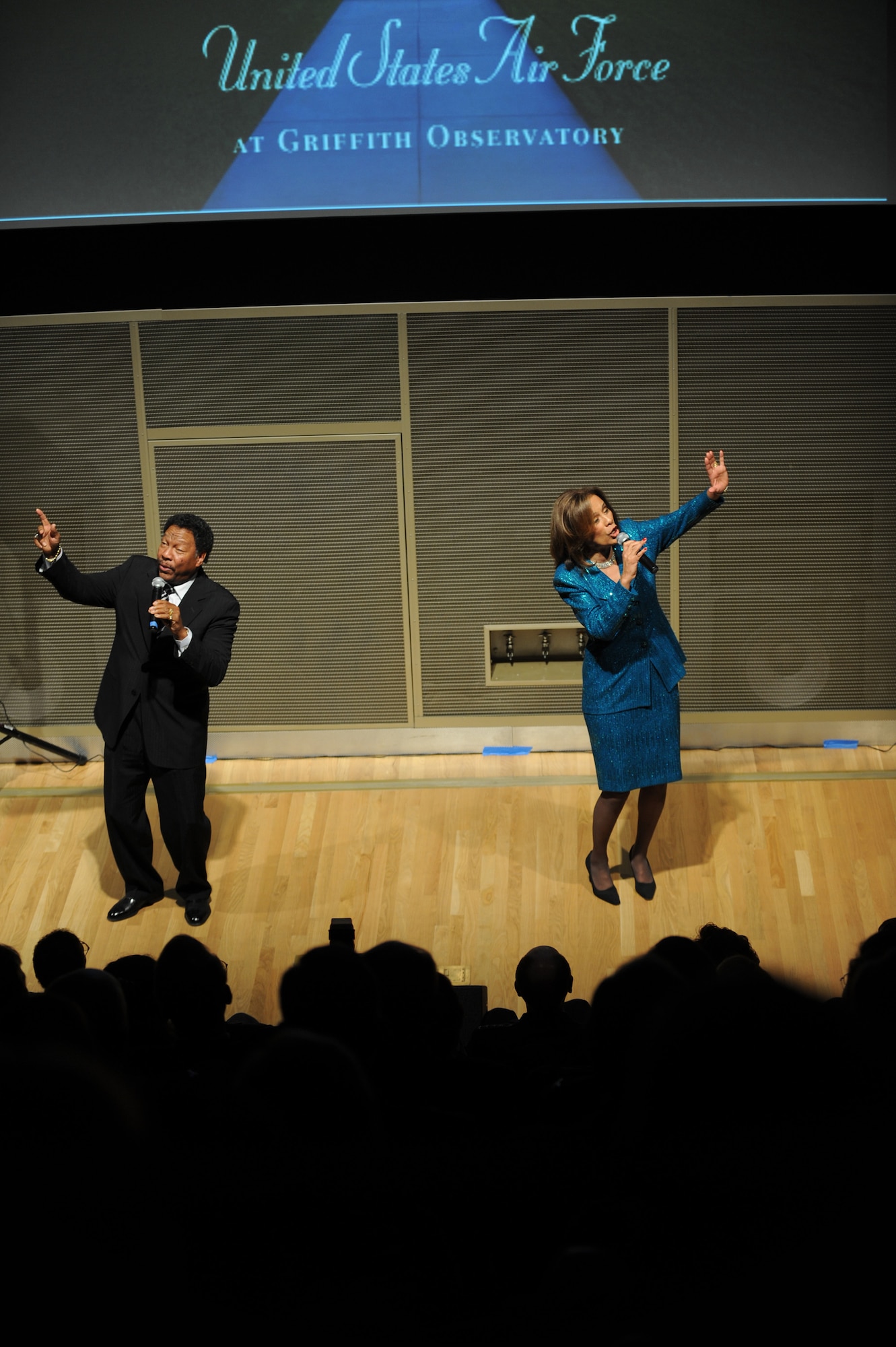 Marilyn McCoo and Billy Davis Jr. sing "Up, Up and Away" Nov. 17 at the Griffith Park Observatory in Los Angeles. Ms. McCoo and Mr. Davis attended an event hosted by the Friends of the Observatory to honor Air Force members during Air Force Week Los Angeles. They were former singers of the group, The Fifth Dimension. (U.S. Air Force photo/Staff Sgt. Desiree N. Palacios)