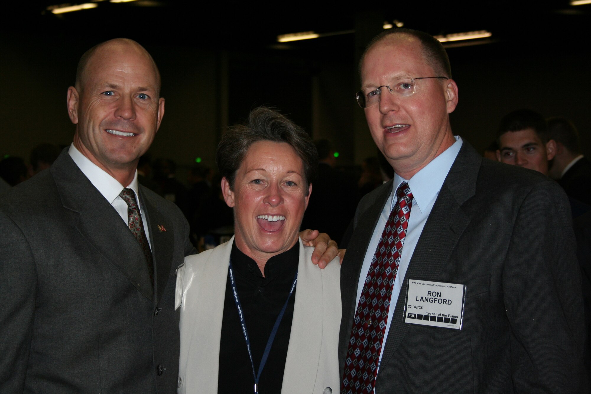 MCCONNELL AIR FORCE BASE, Kan. -- Chief Master Sgt. Michael Hedum, 22nd Air Refueling Wing command chief, Rael Hodgson, McConnell Golden Eagle, and Billy Langford, 22nd Operations Group deputy commander, pose during the Airlift Tanker Association dinner in Anaheim, Calif., Nov. 8. (courtesy photo)