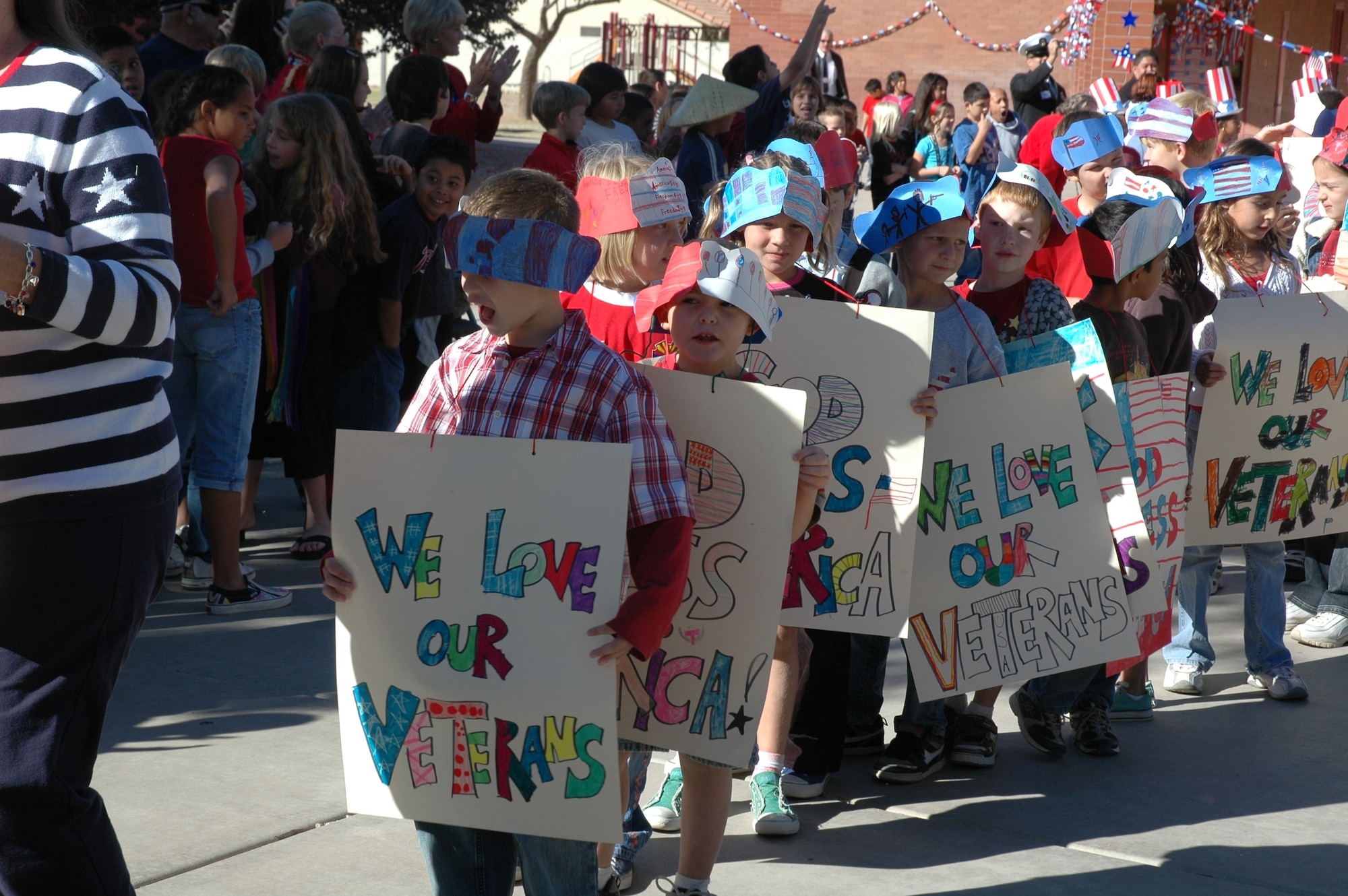 Students at Garden Lakes Elementary School in Avondale, Ariz., conduct a parade during the annual Veteran's Day celebration Nov. 7. Eleven years ago, a teacher at the school started the celebration, held the Friday before Veteran's Day, as an effort to educate students on why they didn't have school Nov. 11. Veterans from nearly every war, race, age and sex have spoken to students throughout the years. (U.S. Air Force photo/Tech. Sgt. Susan Stout)