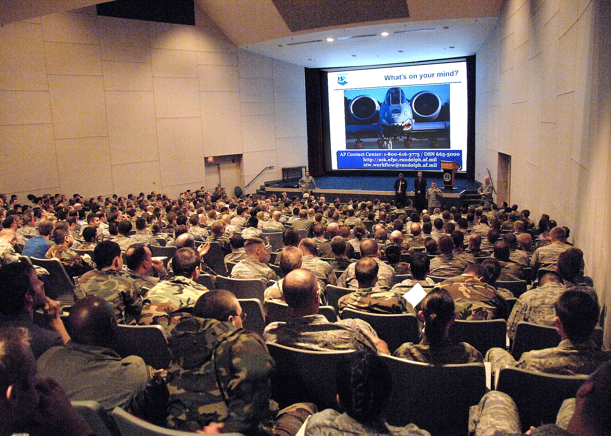 The Air Force Personnel Center "Spread the Word" briefing team speaks to a packed house Nov. 13 at the Air Force Institute of Technology's Kenney Auditorium at Wright-Patterson Air Force Base, Ohio. Maj. Gen. K.C. McClain, Air Force Personnel Center commander, and her team visited the base Nov. 12 to 14 to update the workforce on personnel changes and to seek feedback on the workforce's concerns. (U.S. Air Force photo/Ben Strasser) 