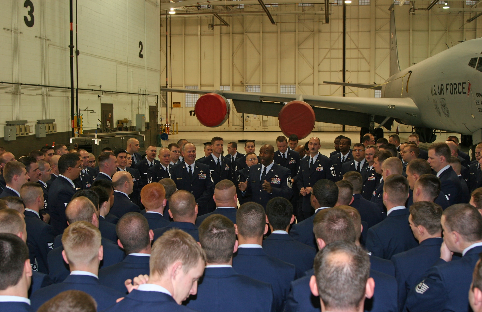 MCCONNELL AIR FORCE BASE, Kan. -- Maintenance chief master sergeants share a mentoring moment with squadron Airmen, during McConnell’s Wingman Day, Nov. 12. The 22nd Aircraft Maintenance Squadron also had an open ranks uniform inspection.  (Photo by Master Sergeant Brent Barr)