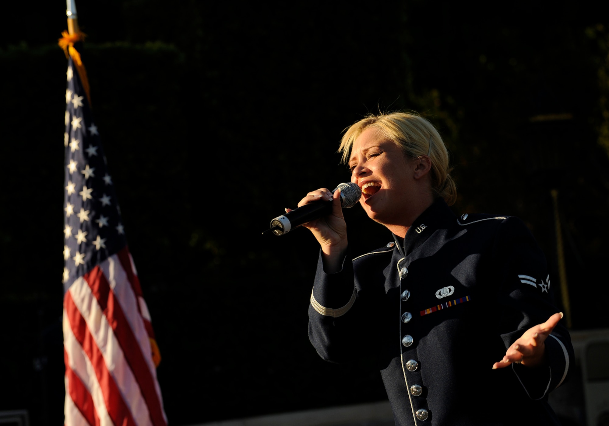Airman First Class Pamela Kelley of the U.S. Air Force Band of the Golden West performs for hundreds of spectators in front of Sleeping Beauty's Castle at the Disneyland Resort in Anaheim, Calif., Nov. 17. The band is performing during Air Force Week Los Angeles, an event designed to educate the local population about the Air Force's capabilities and missions through various activities and exhibitions in the Los Angeles area. 
(U.S. Air Force photo/Staff Sgt. Bennie J. Davis III)