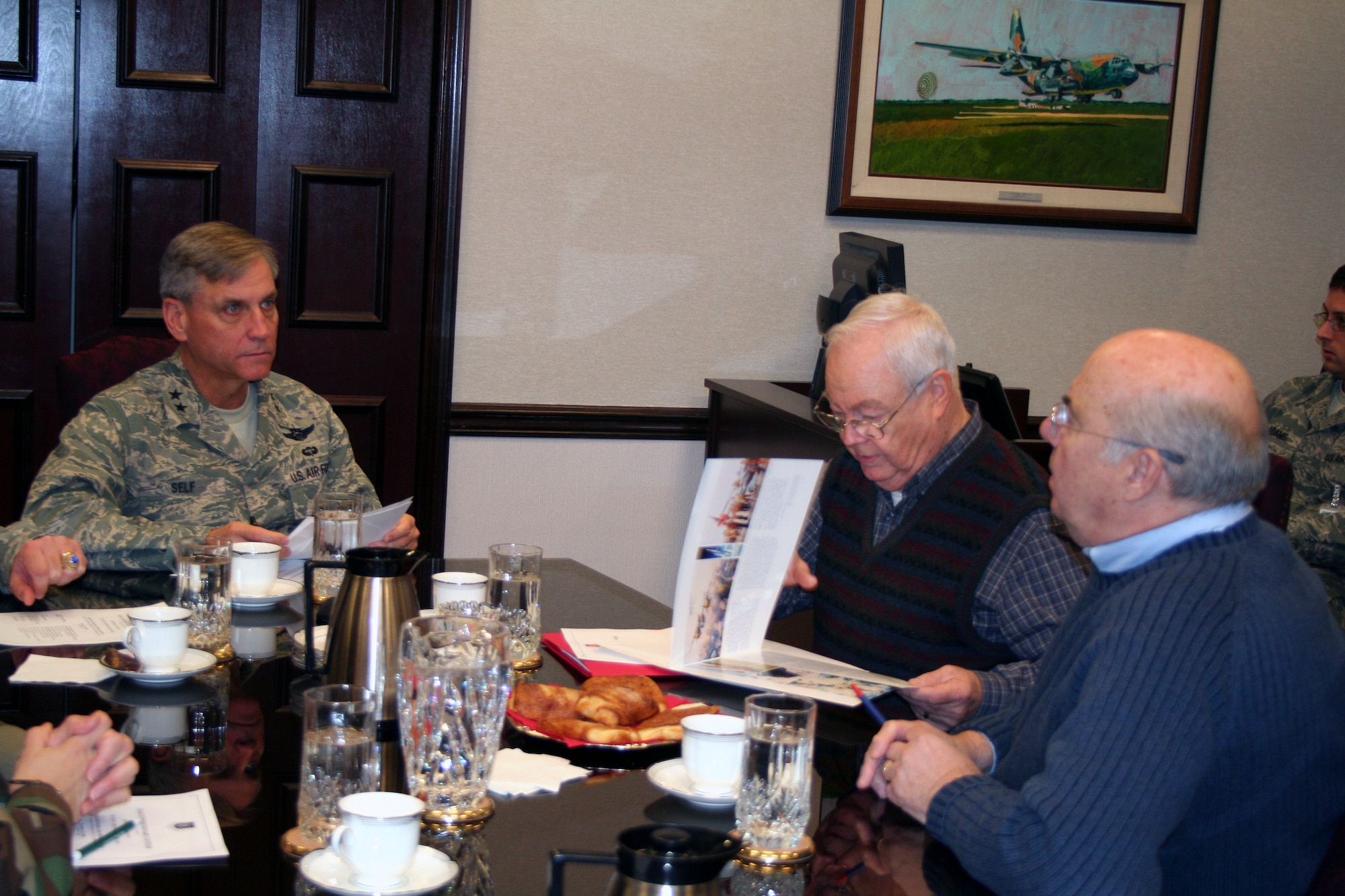 Maj. Gen. Kip Self, U.S. Air Force Expeditionary Center commander, talks with Mr. Keith Ferris, an artist in the Air Force Art Program and honorary chairman of the New York Society of Illustrators, and Mr. John Witt, artist and current chairman of the NY Society, during a visit by Mr. Ferris and Mr. Witt to the Expeditionary Center on Fort Dix, N.J., Nov. 18, 2008.  The two artists visited to learn about the EC mission and discuss future art projects covering EC training. (U.S. Air Force Photo/Tech. Sgt. Scott T. Sturkol)