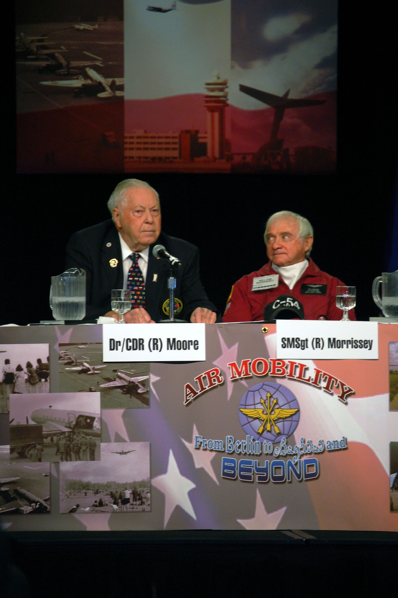 Retired Navy Cmdr. (Dr.) Earl Moore, president of the Berlin Airlift Veterans Association, answers a question as part of the "60th Anniversary of the Berlin Airlift" Panel for the 2008 Airlift/Tanker Association convention Nov. 8 in Aneheim, Calif.  The panel also Gen. Roger Brady, U.S. Air Forces in Europe commander, retired Col. Gail Halvorsen (also known as the "Candy Bomber") and several others. The group highlighted their experiences with the Berlin Airlift in 1948 and refelcted on the 60th anniversary.  (U.S. Air Force Photo/Tech. Sgt. Scott T. Sturkol)