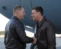 Col. John "Red" Millander greets Brig. Gen. Bradley Pray on the Charleston AFB flightline Nov. 18. The P-180 C-17 is the first new aircraft the base has received since 2003. Colonel Millander is the 437th Airlift Wing commander and General Pray is the deputy director of Air, Space and Information Operations, Headquarters Air Mobility Command, Scott AFB, Ill. (U.S. Air Force photo/Airman 1st Class Katie Gieratz) 