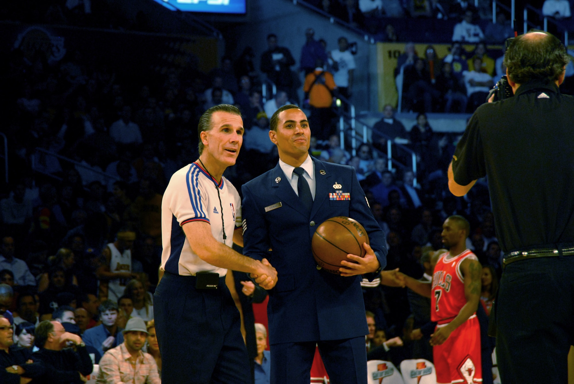 Staff Sgt. Andre Stevens presents the game ball before a Chicago Bulls and Los Angeles Lakers basketball game Nov. 18 at the Staples Center in Los Angeles. Sergeant Stevens is a computer operator with the Space Superiority Systems Wing at Los Angeles Air Force Base, Calif. (U.S. Air Force photo/Joe Juarez) 
