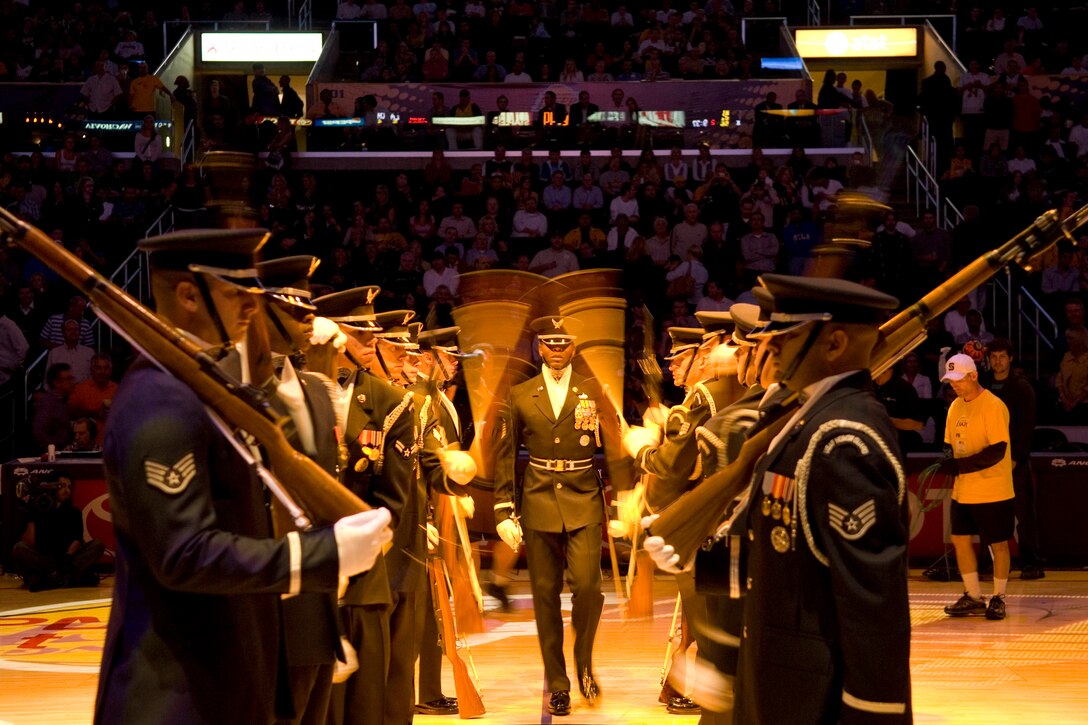 The Air Force Honor Guard drill team performs during a nationally telecast Chicago Bulls and Los Angeles Lakers basketball game in front of nearly 20,000 fans Nov. 18 at the Staples Center in Los Angeles. (U.S. Air Force photo/Staff Sgt. Raymond Hoy) 
