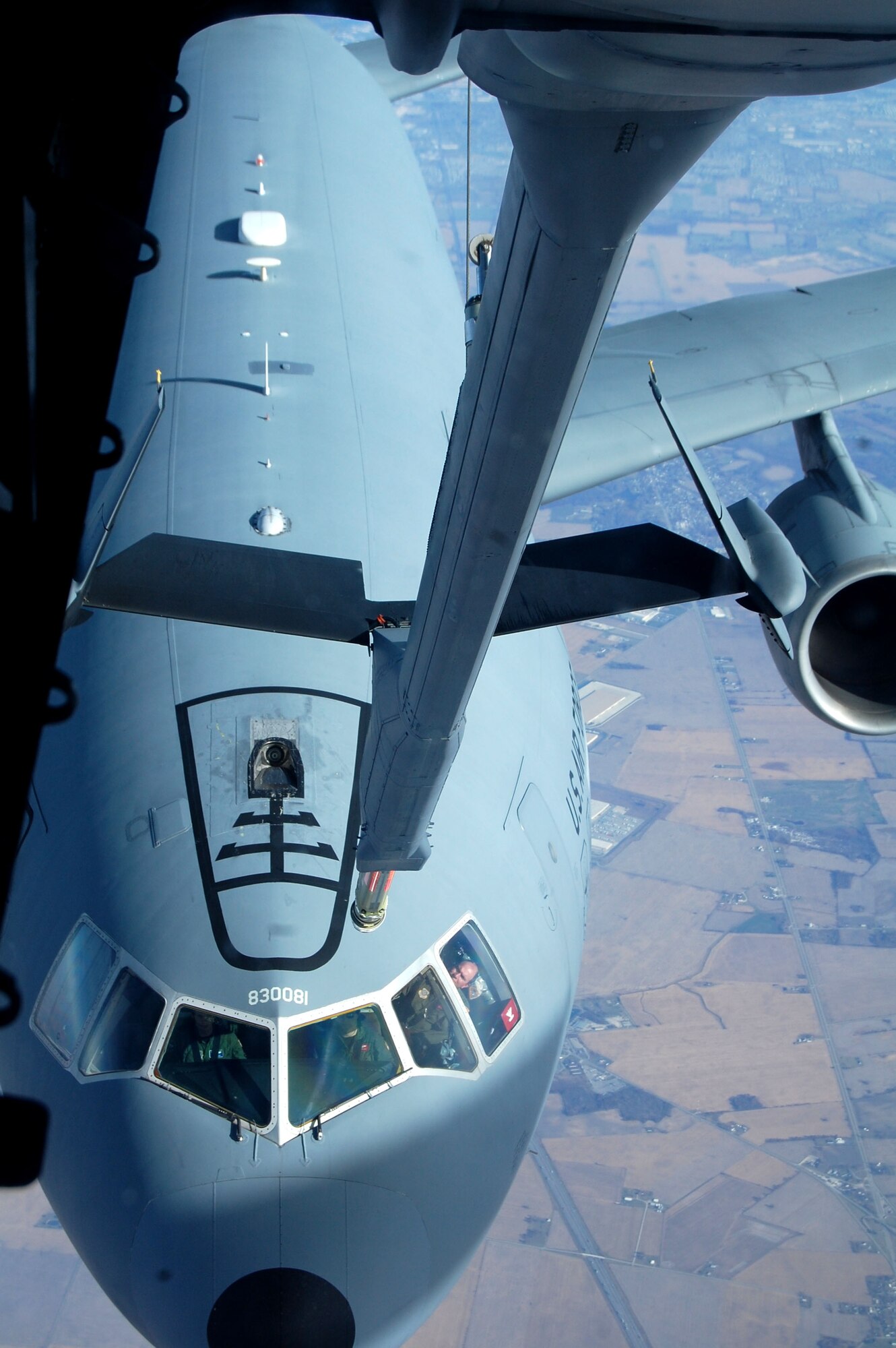 A KC-10 Extender from McGuire Air Force Base, N.J., prepares to be refueled by another KC-10 from McGuire Nov. 6, 2008, over the central United States.  The KC-10 is one of the aircraft stationed at McGuire that helps the Air Force "fly, flight and win ... in air, space and cyberspace." (U.S. Air Force Photo/Tech. Sgt. Scott T. Sturkol)
