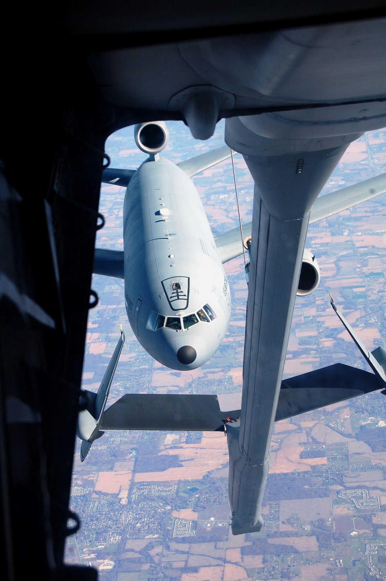 A KC-10 Extender from McGuire Air Force Base, N.J., prepares to be refueled by another KC-10 from McGuire Nov. 6, 2008, over the central United States.  The KC-10 is one of the aircraft stationed at McGuire that helps the Air Force "fly, flight and win ... in air, space and cyberspace." (U.S. Air Force Photo/Tech. Sgt. Scott T. Sturkol)