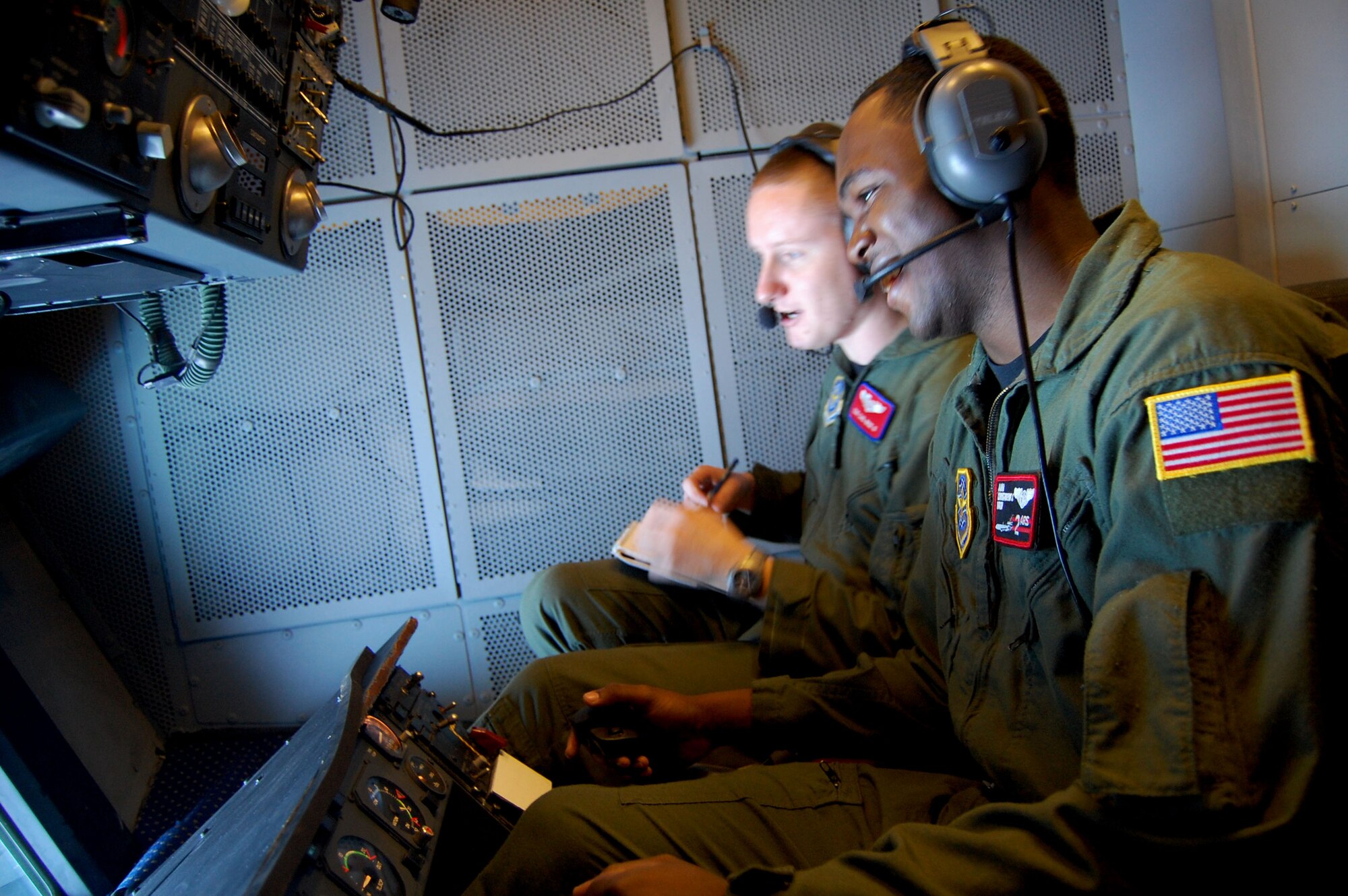 Airman Christopher Nixon, 2nd Air Refueling Squadron, receives instruction from Staff Sgt. Carl Wise II, 305th Operations Support Squadron KC-10 Formal Training Unit, during an air refueling in a KC-10 Extender from McGuire Air Force Base, N.J., Nov. 6, 2008, over the central United States.  Both Sergeant Wise and Airman Nixon are boom operators.  (U.S. Air Force Photo/Tech. Sgt. Scott T. Sturkol)