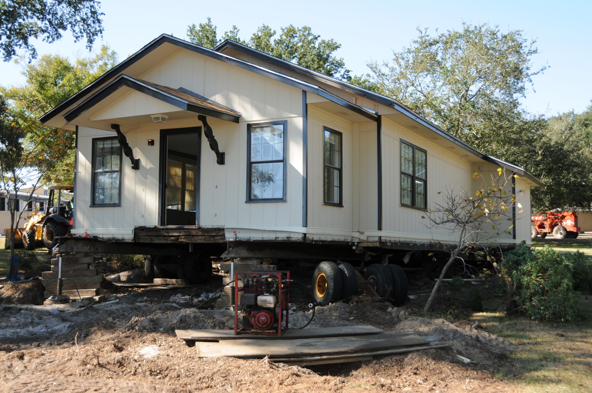 Arnold Cottage, used to lodge distinguished visitors to the base for the past 67 years, is being moved to a spot behind the Larcher Chapel, where it will be placed on a new foundation and renovated, according to Al Watkins, 81st Civil Engineer Squadron.  Its former location at the southwest corner of Larcher Boulevard and Chappie James Avenue is being cleared for construction of a $12,216 training development facility.  (U.S. Air Force photo by Kemberly Groue)