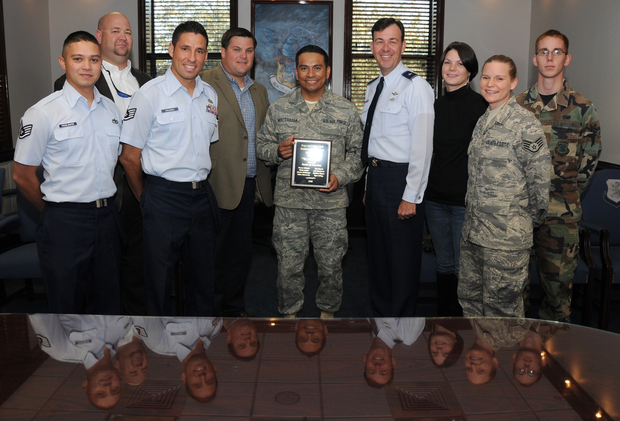 From left, Staff Sgt. Charles Pichelmayer, James Morgan, Staff Sgt. Ranson Coleman, Windy Swetman III, Luis Monterrosa, Brig. Gen. Greg Touhill, Robin Monterrosa, Staff Sgt. Erin Kornack and Airman 1st Class Aaron Hanson gather  at 81st Training Wing headquarters Nov. 17 for presentation of a plaque recognizing the winner of the recent D’Iberville Kickball Tournament benefiting the Boys and Girls Clubs of the Gulf Coast.  Sergeants Pichelmayer, Coleman, Monterrosa and Kornack, Airman Hanson and Mrs. Monterrosa played on the winning team.   Mr. Swetman is Harrison County District 1 supervisor and Mr. Morgan is Mr. Swetman’s field representative.  General Touhill is the 81st TRW commander.  (U.S. Air Force photo by Kemberly Groue)