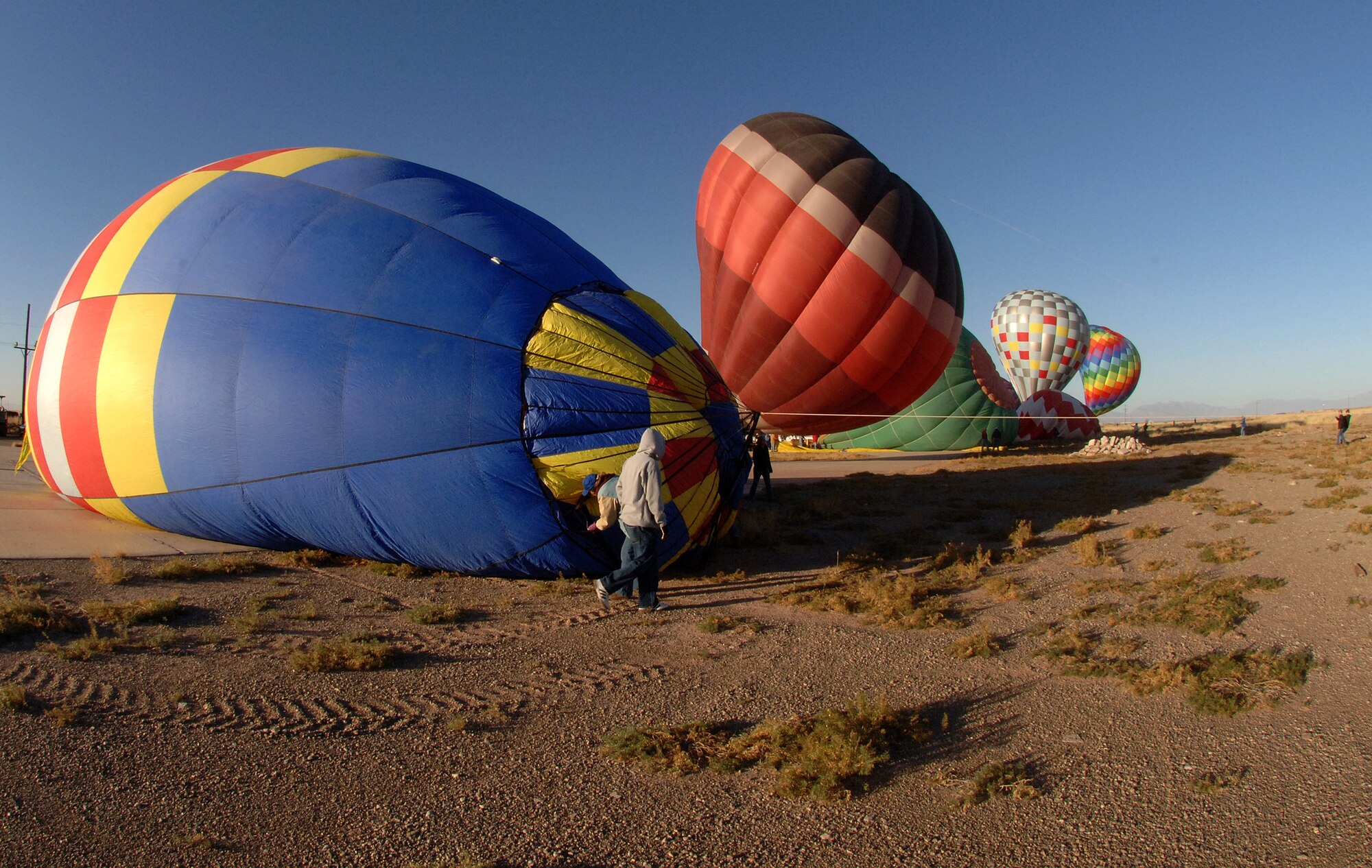 Members of Team Holloman and the local community set up their Hot Air Balloons at Holloman Air Force Base, N.M., Nov. 15. Several people from Holloman and the local area came out for the Holloman Balloon Fest.  (U.S. Air Force photo/Airman 1st Class Michael Means)