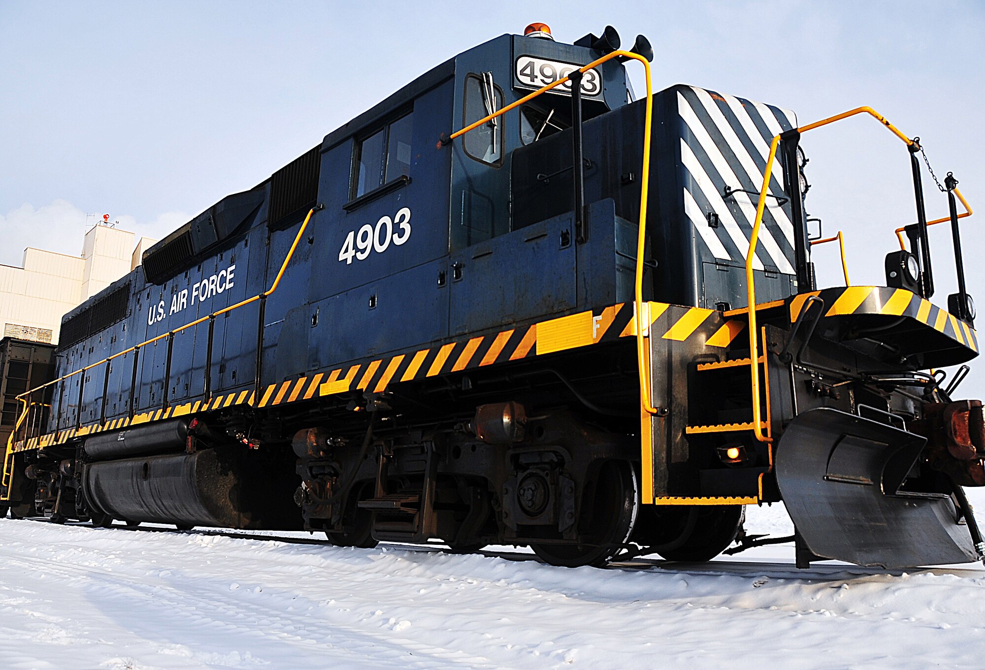 A 127 ton GP-40 Electromotive Diesel locomotive sits outside the Eielson Air Force Base central heat and power plant, Oct. 24, 2008, waiting to retrieve its next shipment of coal. The central heat and power plant owns two of these, they move all coal and rail traffic on the 11 miles of Eielson rail, making it the second largest railroad in the state. (U.S. Air Force photo by Airman 1st Class Willard E. Grande II)