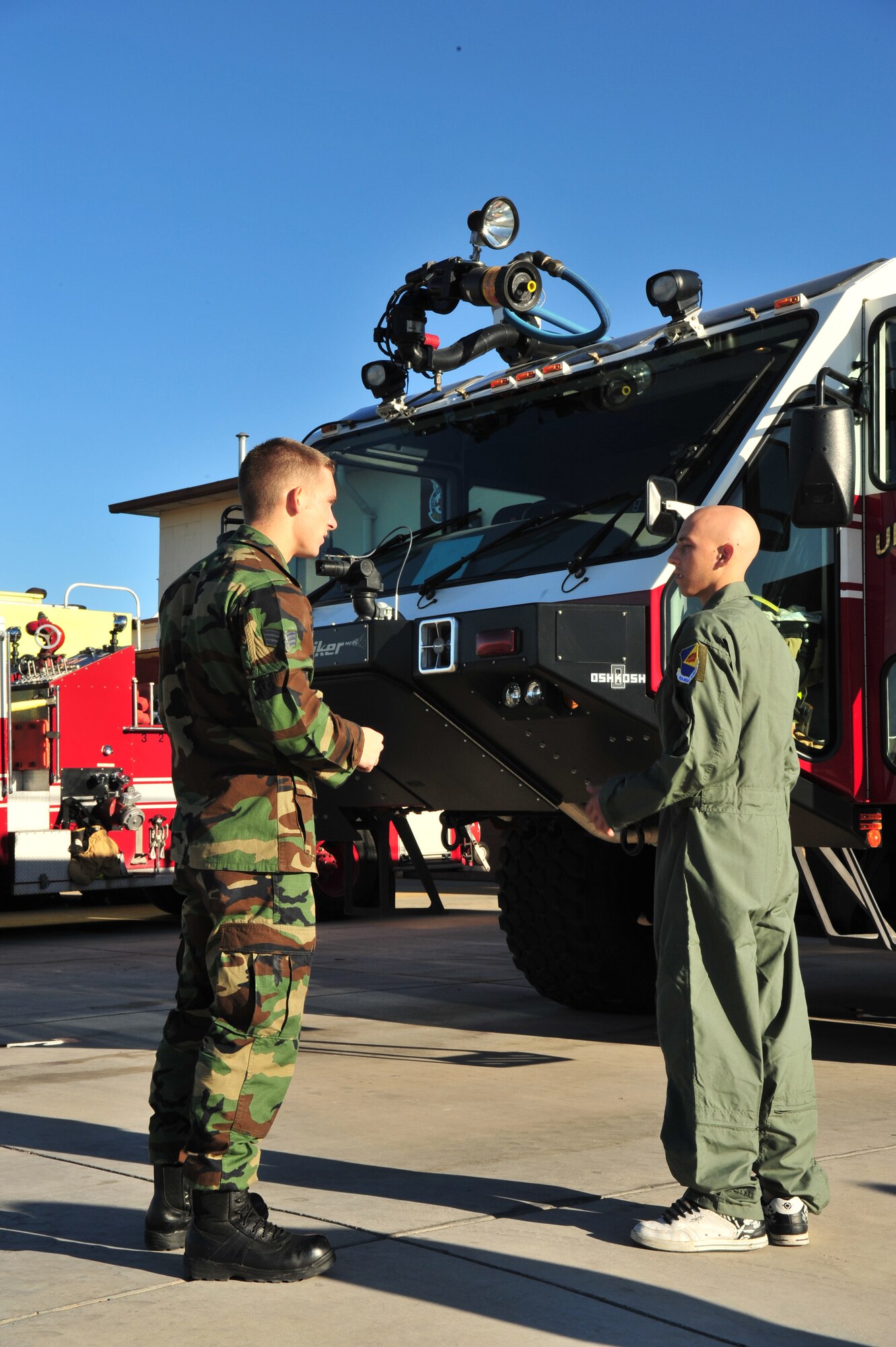 SrA Noah Leiter, 355th Civil Engineer Squadron, shows Pilot For A Day James Nasby, 17 years old,  the different types of fire trucks at D-M November 14. The Pilot For A Day program is designed to help children with disabilities or serious illness enjoy a day focused on them and their interest in aviation. Activities in the program include: visiting the base fire department, using Night Vision goggles, flying an A-10 simulator, and seeing an A-10 up close. (U.S. Air Force photo/Senior Airman Noah R. Johnson)
