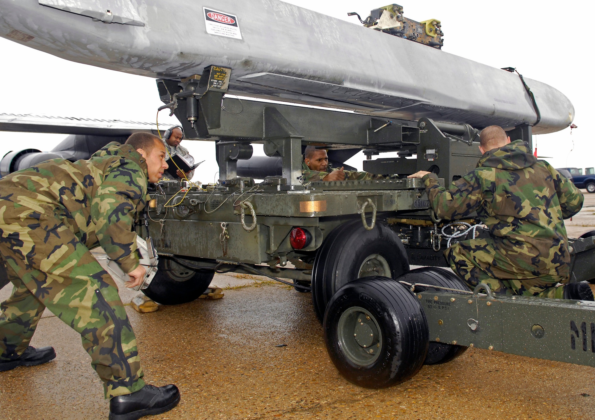 A 2nd Maintenance Squadron weapons load team is evaluated during a portion of the Air Combat Command Nuclear Surety Inspection here Nov. 12 at Barksdale Air Force Base, La. ACC Inspector General officials graded the base's nuclear surety program management and administration, the personnel reliability program and logistics movement. (U.S. Air Force photo/Senior Airman Alexandra Sandoval) 

