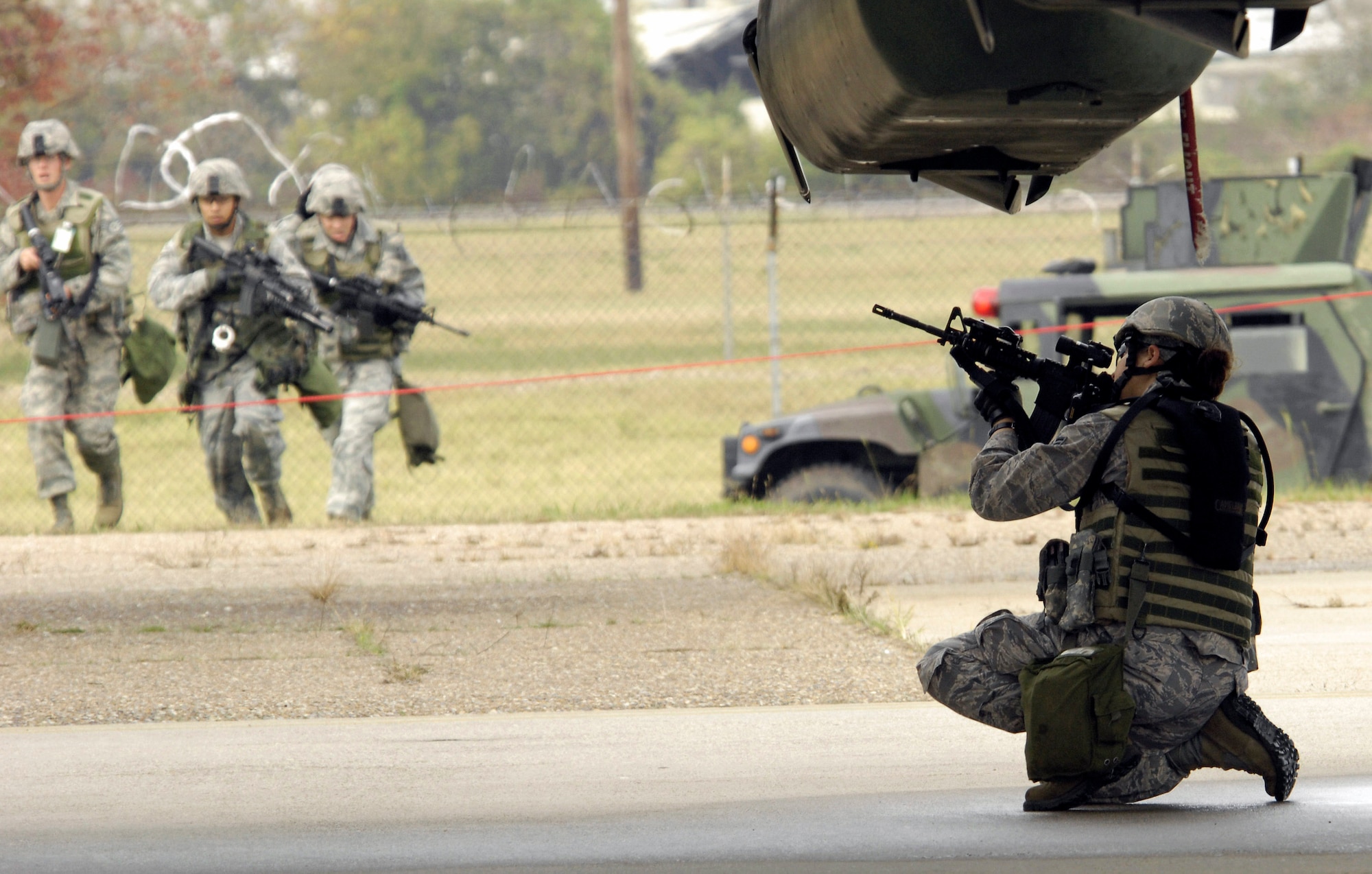 Members of the 2nd Security Forces Squadron perform recapture and recover operations during a portion of the Air Combat Command Nuclear Surety Inspection Nov. 12 at Barksdale Air Force Base, La. ACC Inspector General officials graded the base's nuclear surety program management and administration, the personnel reliability program and logistics movement. (U.S. Air Force photo/Senior Airman Alexandra Sandoval) 
