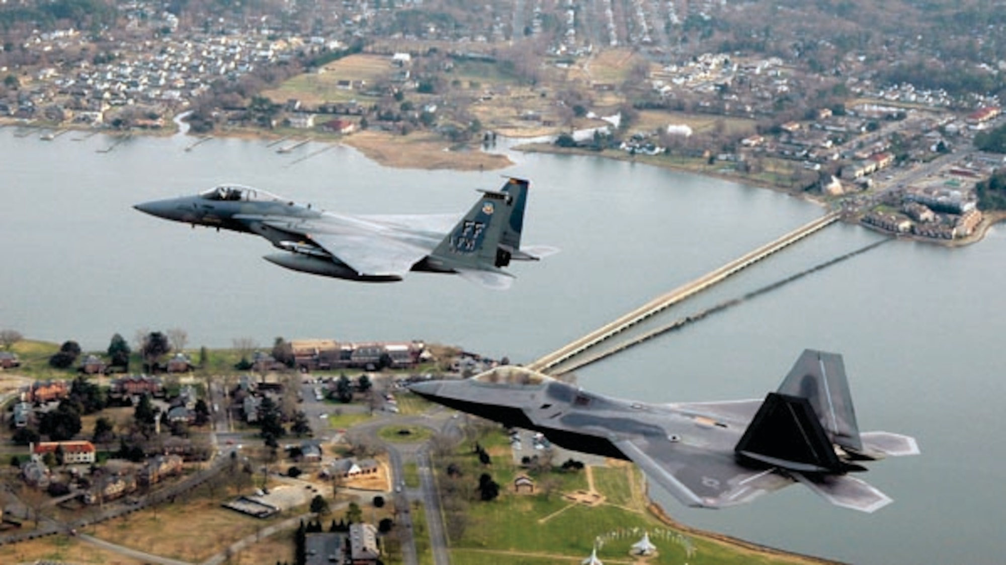 An F-15 Eagle and F-22 Raptor 2-ship formation over Langley Air Force Base, Va. (U.S. Air Force photo)