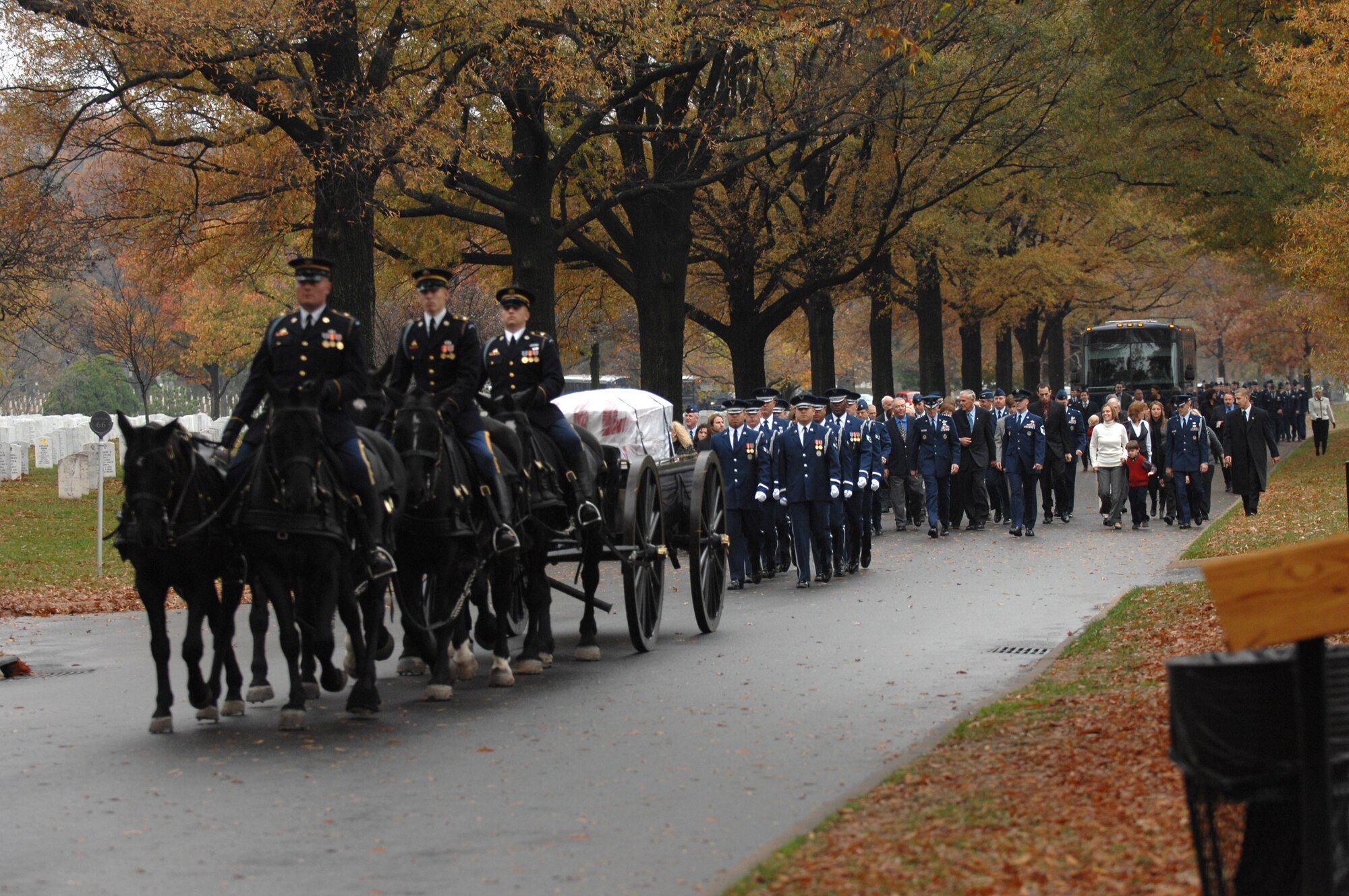 A full funeral procession marches for a group burial ceremony for six fallen crewmembers of a B-52 Stratofortress that crashed July 21 off Guam's Northwest coast Nov. 14 at Arlington National Cemetery in Virginia. Five of the crew members were stationed at Barksdale Air Force Base, La., deployed to Guam with the 20th Expeditionary Bomb Squadron as part of the Defense Department's continuous bomber presence mission in the Pacific. The sixth crewmember was the deputy commander of 36th Medical Group at Andersen AFB, Guam. (U.S. Air Force photo/Staff Sgt. Catherine Thompson) 
