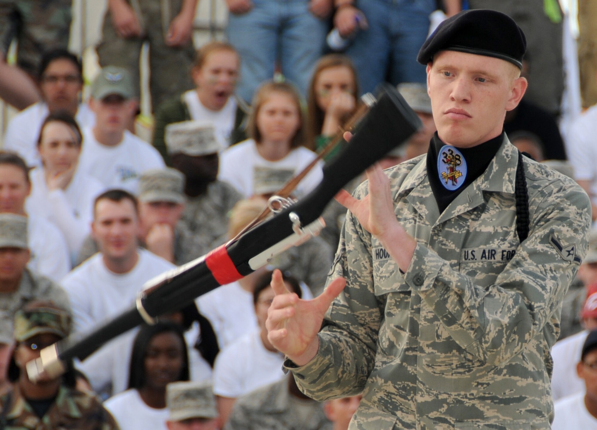 Airman Corey Houpt, drillmaster for the Dark Knights, twirls his rifle during Friday’s freestyle competition.  (U.S. Air Force photo by Kemberly Groue)