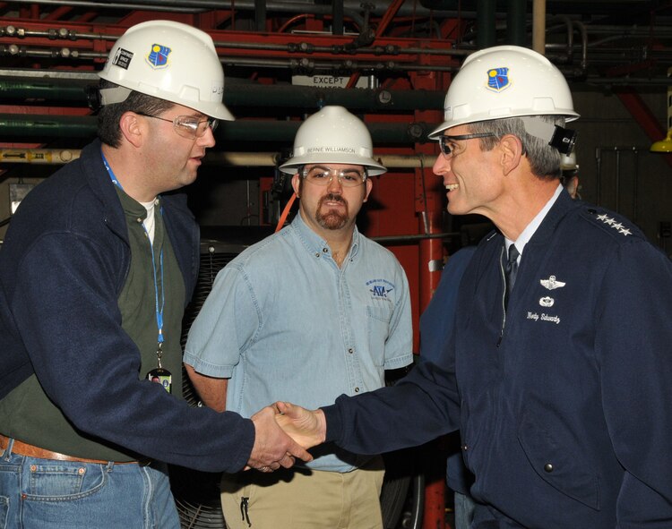 Chief of Staff of the Air Force Gen. Norton Schwartz greets an engineer in the Aeropropulsion Systems Test Facility Monday at Arnold Engineering Development Center Commander. (Photo by David Housch)