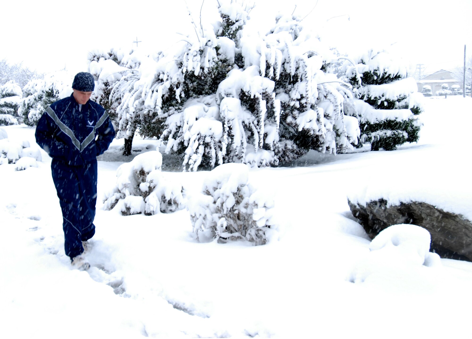 An 8th Fighter Wing Airman heads home through the snow after morning PT at Kunsan Air Base, Republic of Korea, Nov. 19, 2008. Kunsan received more eight inches of snow during the first winter storm of 2008. (U.S. Air Force Photo by Master Sgt John M. Foster)