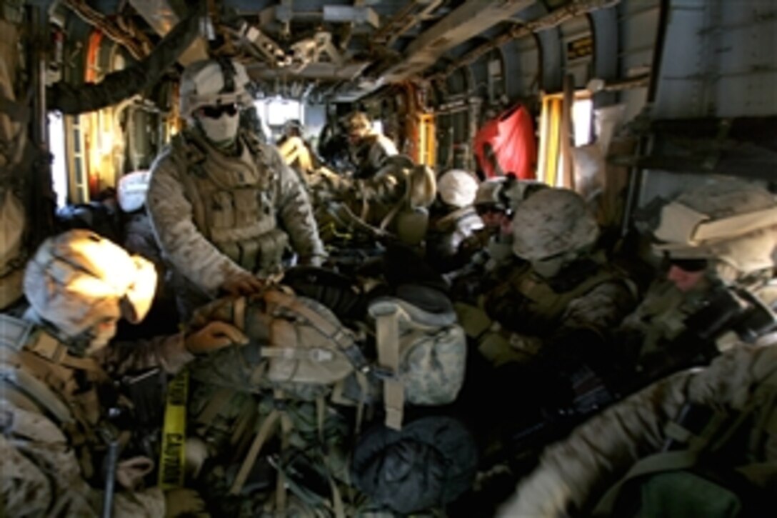 U.S. Marines assigned to Lima Company, 3rd Battalion, 8th Marine Regiment, ride in a CH-53 Super Stallion helicopter to replace the Marines of Fox Company 2nd Battalion, 7th Marine Regiment, in Now Zad, Helmad Province, Afghanistan, Nov. 17, 2008. The Marines are supporting the NATO International Security Assistance Force mission in Afghanistan.