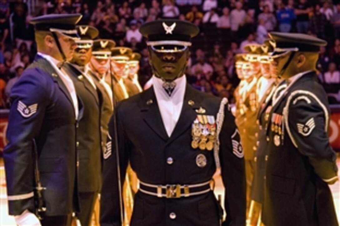 The Air Force Honor Guard drill team performs during a National Basketball Association game between the Chicago Bulls and Los Angeles Lakers in front of nearly 20,000 fans at the Staples Center in Los Angeles, Calif., Nov. 18, 2008.