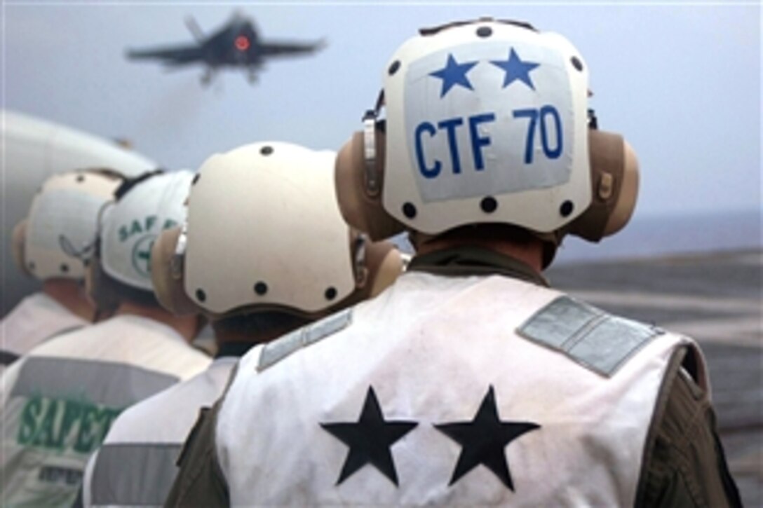 U.S. Navy Rear Adm. Rick Wren, commander Task Force 70, observes flight operations aboard the Nimitz-class aircraft carrier USS George Washington with members of the Japanese Maritime Self Defense Force, Pacific Ocean, Nov. 18, 2008. The permanently forward deployed George Washington Carrier Strike Group is conducting bi-lateral training operations in the Pacific Ocean with the Japanese Maritime and Air Self-Defense Forces to increase interoperability and strengthen their maritime partnership.