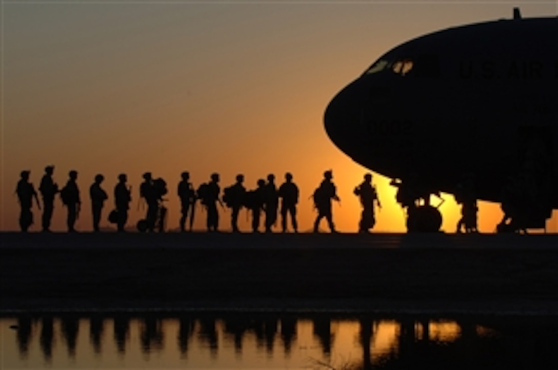 U.S. Army soldiers wait to board a C-17 Globemaster III aircraft at Joint Base Balad, Iraq, on Nov. 17, 2008.  The aircraft is deployed from the 437th Airlift Wing out of Charleston Air Force Base, S.C.  