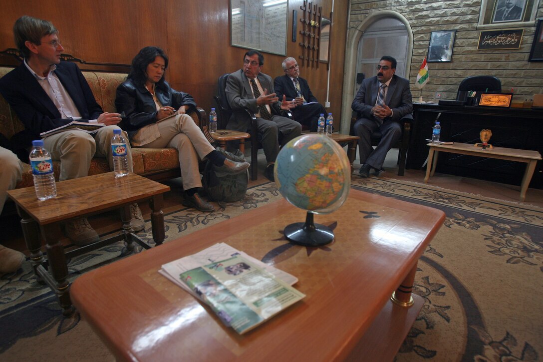 – U.N. and U.S. State Department officials talk with a Sinjar City district deputy mayor here Nov. 19. In war, every Marine is as much a statesman as a rifleman. Iraq is no different. Military Police and Transportation Platoon Marines facilitated a meeting between U.N. and U.S. State Department officials, and Sinjar City’s key leaders. The meeting couldn’t have come at a better time. Sinjar’s people are in dire need of infrastructure improvements, such as water and electricity.::r::::n::With 44 thousand internally displaced families, Sinjar City has been pushed past its breaking point. Couple the increased population with a fleeing insurgency, which has taken refuge in the northern provinces of Iraq, and Sinjar is in desperate need of a solution. The Marines of Combat Logistics Company 19, 1st Marine Logistics Group, make up one element of the first Marine Air Ground Task Force outside al Anbar province since 2004. They traveled to the Ninawah province to conduct counter-insurgency operations aimed at stamping out the insurgency just west of the restive city of Mosul.