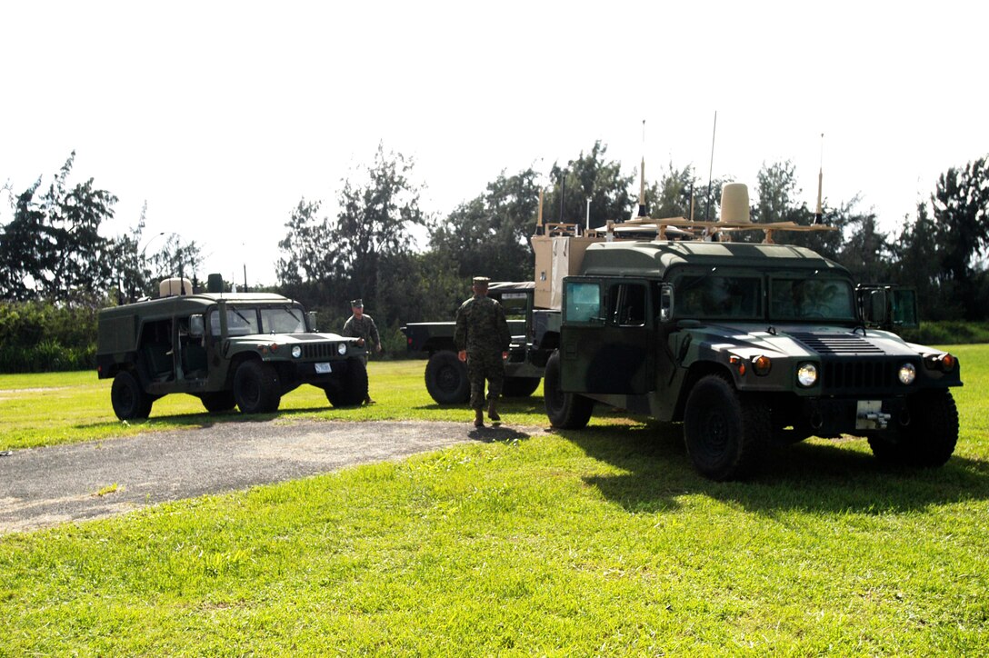 Marines from several 3rd Marine Regiment units demonstrate the capabilities of the Mobile Bodular Command and Control Enhanced Prototype here Nov. 20. The  MEP is a humvee-mounted communication command center.