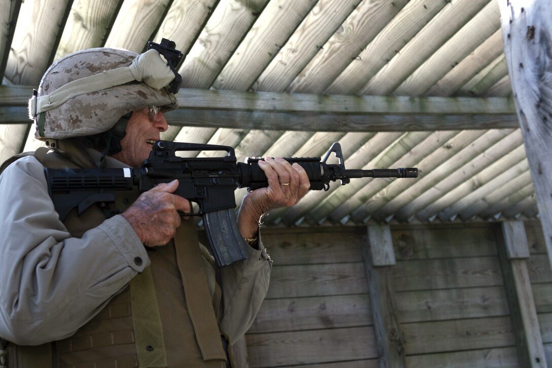 Garland LeRoy, a native of Nokesville, Va., and a veteran of the Battle of Tarawa, participates in a live-fire rifle range during “Tarawa Day” on Nov. 20. The veterans attended a memorial service, viewed a non-lethal weapons demonstration and fired pistols and rifles. “Shooting the rifles brought back some memories,” said Henry C. Norman, a native of Springhill, Fla., and veteran of the battle. “We first had the M-1 rifle and then they gave us the carbines, so it was very interesting to shoot the M-16 rifle.” (Official U.S. Marine Corps photo by Lance Cpl. Casey Jones) (RELEASED)